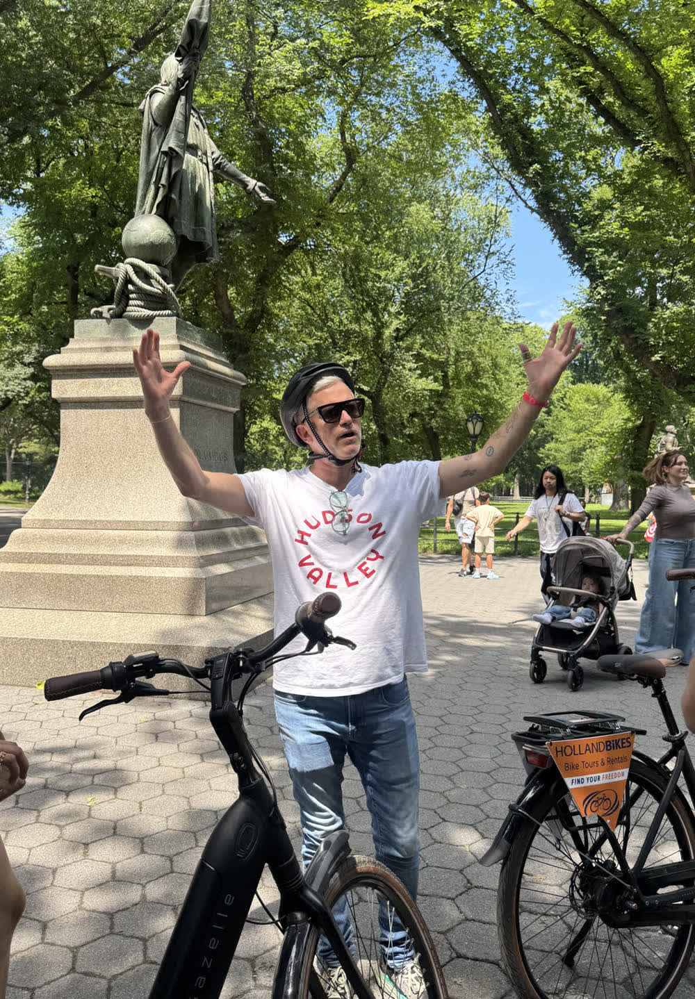 Pim explaining and gesturing on a New York tour